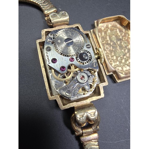 299 - A good quality vintage hallmarked 9ct yellow gold ladies wristwatch by Baume, the case and the strap... 