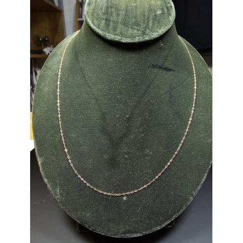 302 - A 9ct yellow gold neck chain along with a 9ct gold and silver panel bracelet and 2 pairs of cuff-lin... 