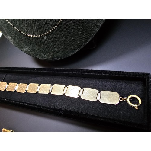 302 - A 9ct yellow gold neck chain along with a 9ct gold and silver panel bracelet and 2 pairs of cuff-lin... 