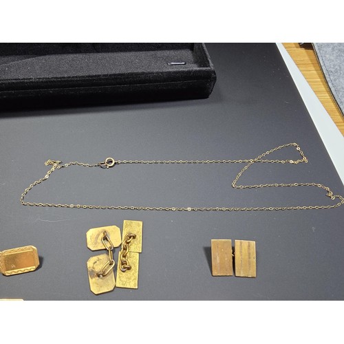 302 - A 9ct yellow gold neck chain along with a 9ct gold and silver panel bracelet and 2 pairs of cuff-lin... 