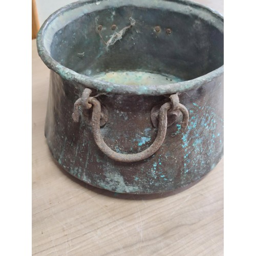 438 - Pair of antique copper pans with wrought iron handles, one pan has holes to the base largest has a h... 