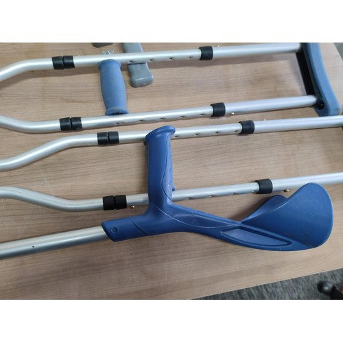 452 - A collection of disability aid items including pair of underarm crutches, 3x arm crutches all are ad... 