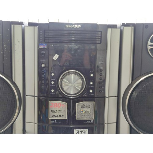 471 - Sharp stereo system with 5 disc auto changer, double tape deck and radio, complete with speakers and... 