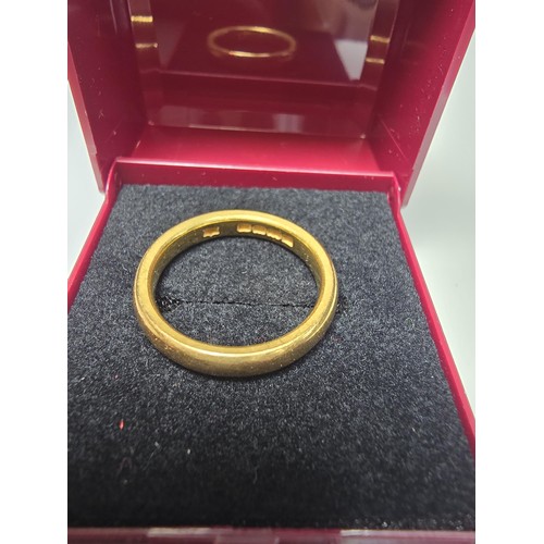 308 - A chunky hallmarked 22ct yellow gold plain wedding band ring in excellent clean condition and boxed.... 