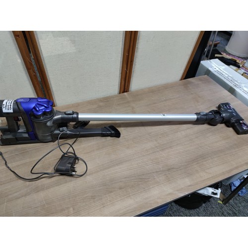 479 - Fully re conditioned Dyson DC34 hand held vacuum cleaner complete with accessories, charger and batt... 