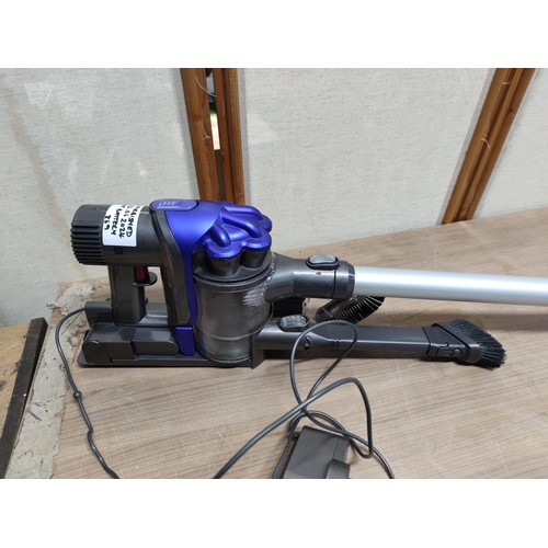 479 - Fully re conditioned Dyson DC34 hand held vacuum cleaner complete with accessories, charger and batt... 