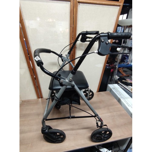 483 - A good quality collapsible wheeled walking aide with a seat, has brakes on the handle bars