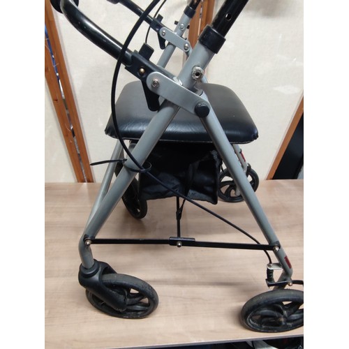 483 - A good quality collapsible wheeled walking aide with a seat, has brakes on the handle bars