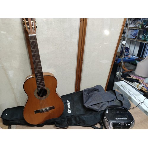 484 - A classical guitar along with a GPO retro cd player.