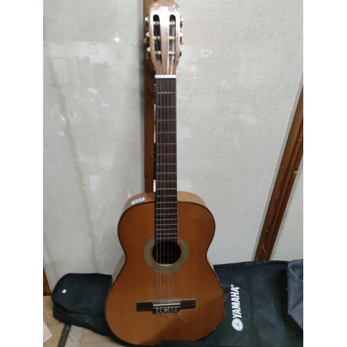 484 - A classical guitar along with a GPO retro cd player.