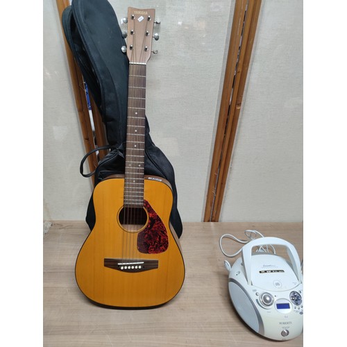 485 - A Yamaha junior guitar along with a Roberts cd player.