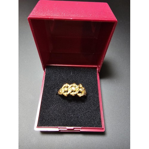 314 - A hallmarked 18ct yellow gold ring with a 3 knot design. In excellent clean condition and boxed ,siz... 