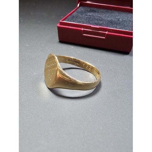 313 - A hallmarked 9ct yellow gold gents ring, size U.5 with a weight of 3.35g, boxed.