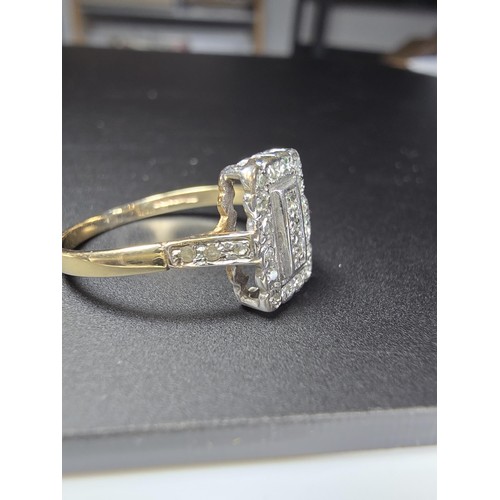 318 - A hallmarked 9ct yellow and white gold Art Deco ring inset with many small diamonds. In excellent cl... 