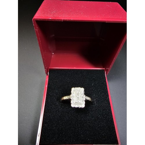 318 - A hallmarked 9ct yellow and white gold Art Deco ring inset with many small diamonds. In excellent cl... 