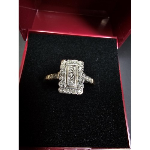 318 - A hallmarked 9ct yellow and white gold Art Deco ring inset with many small diamonds. In excellent cl... 