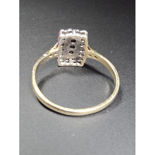 318 - A hallmarked 9ct yellow and white gold Art Deco ring inset with many small diamonds. In excellent cl... 