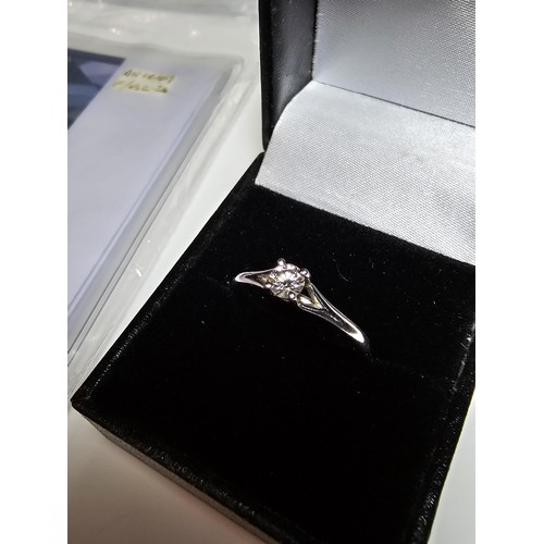 322 - A fine quality 950 platinum diamond solitaire ring inset with a 0.24 ct diamond with a full diamond ... 