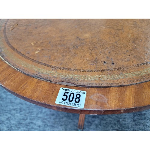 508 - Round mahogany occasional table with leather top (slight damage) on tripod legs with brass claw feet... 