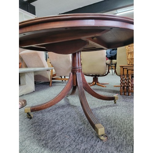 520 - Round Edwardian tilting top mahogany dining table with fine inlay to out rim, on for legs with brass... 