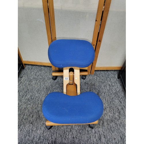 535 - Blue upholstered kneeling stool to promote good posture on castors