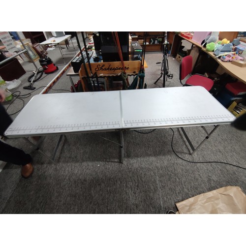 94 - Large white collapsible table with measurements marked on one side possibly as a seamstress table, f... 
