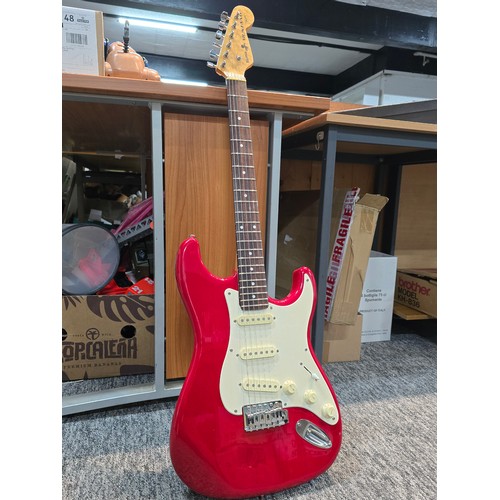34A - A good quality vintage Sunn Mustang by Fender electric guitar in candy apple red featuring a solid b... 