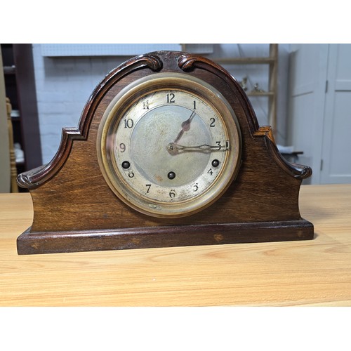 174 - An antique mantel clock with a mahogany case featuring a good quality Garrard England movement, with... 