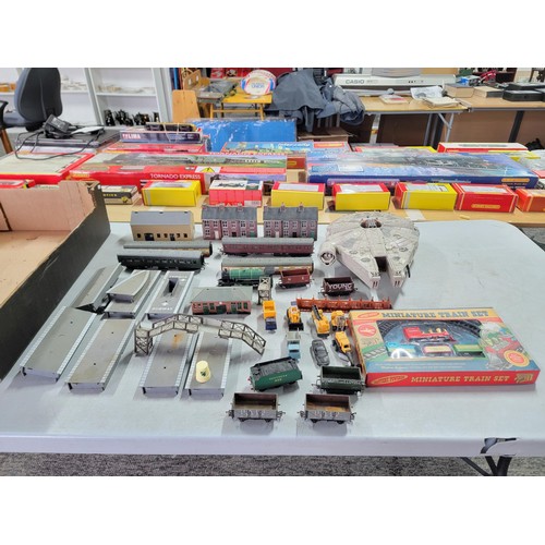 75 - A box containing a quantity of model train items including carriages, wagons, buildings, platforms, ... 