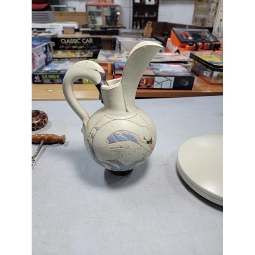 79 - A small quantity of collectables including a studio pottery swan formed jug, vintage corkscrews, can... 