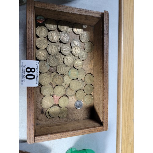 80 - A box of collectables to include an art deco copper tray, a small quantity of threepence coins, mini... 