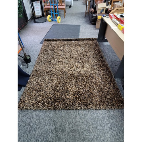 89 - A good quality Indian brown espeda thick pile rug in excellent condition and from a pet free and smo... 