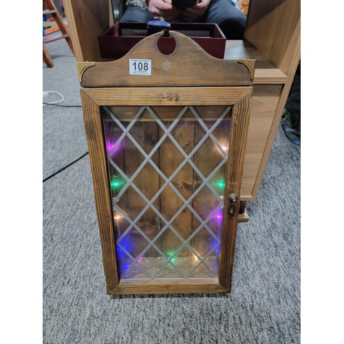 108 - Wooden wall hanging glazed unit with leaded glass with coloured lighting inside height of 60cm high,... 