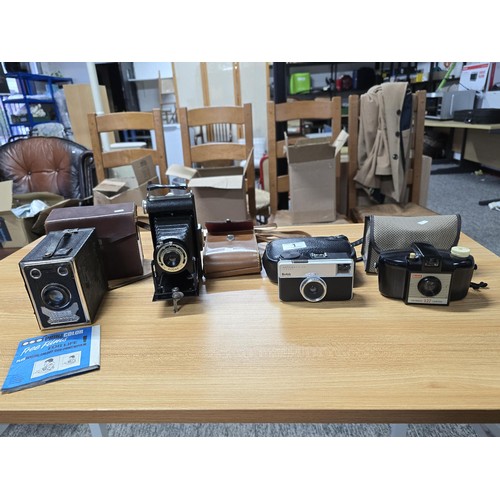 1 - A collection of 4x vintage cameras to include a Kodak brownie six-20, a Balda front box, along with ... 