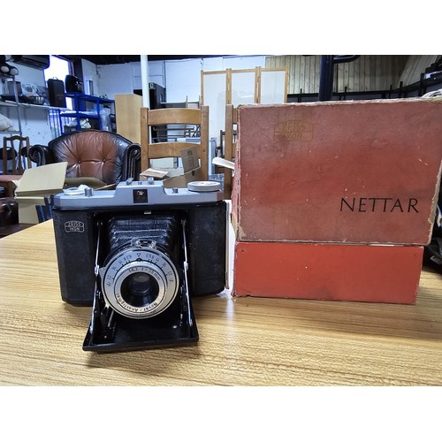 3 - A quantity of cameras to include a good vintage Zeiss Ikon Nettar folding camera with its original b... 