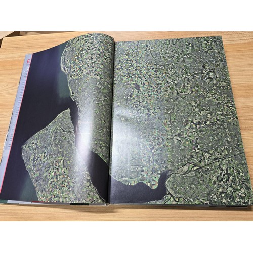 5 - A large book titled England the photographic atlas by Get Mapping.com containing a very large quanti... 