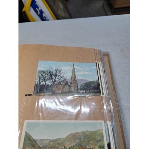 124 - Large blue album containing 250 north wales Antique postcards inc Rhos on sea, Lllangollen, Bettws -... 