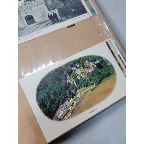 124 - Large blue album containing 250 north wales Antique postcards inc Rhos on sea, Lllangollen, Bettws -... 