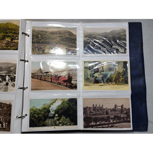 124 - Large blue album containing 250 north wales Antique postcards inc Rhos on sea, Lllangollen, Bettws -... 