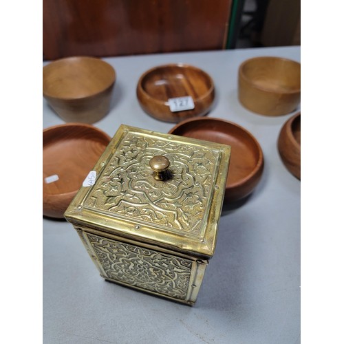 127 - 6x wooden handmade bowls in various sizes along with a brass embossed lidded tea caddy, lead lined. ... 