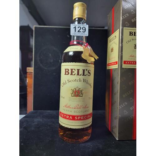 129 - Boxed vintage 1980's new and sealed bottle of Bells Whisky Extra Special complete with red string an... 