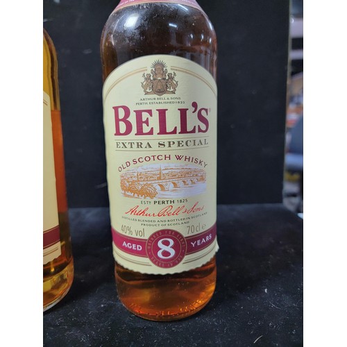 134 - 2x bottles of 8 year matured Bells Whisky new and sealed  in good order