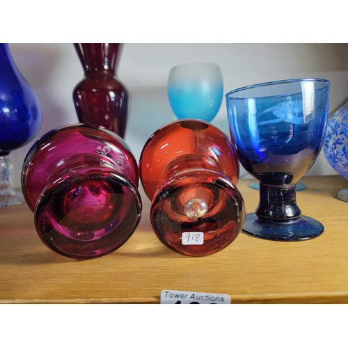 136 - Collection of 8x glass items inc a cranberry glass air buuble vase, tall ruby coloured vase, hand de... 