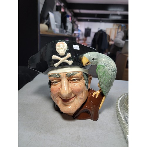 139 - Royal Doulton character jug Long John silver D. 6335, in good order along with a dressing table set ... 