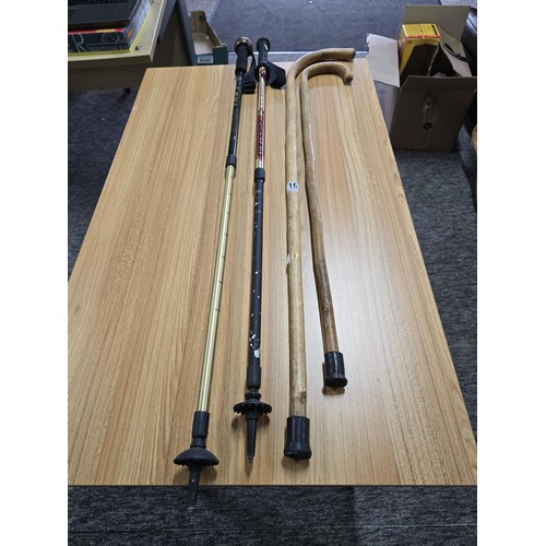 16 - 2 x Height adjustable walking poles see pictures for the makers mark along with 2 wooden walking sti... 