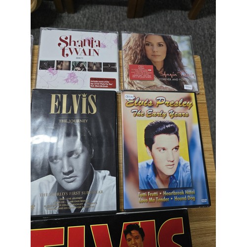 36 - Quantity of books, DVD's and CD's all relating to Elvis Presley and Shania Twain, along with a large... 