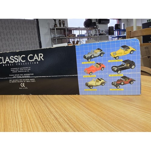 44 - A classic car diecast model collection containing 6 cars in unused condition.