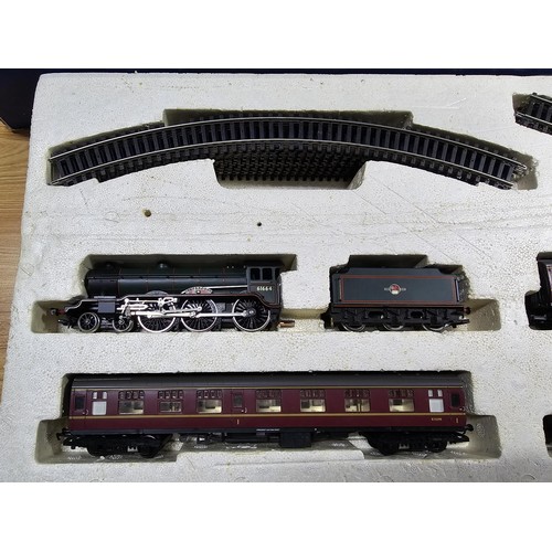 56 - A rare boxed Hornby R1007 football special train set to include Liverpool loco and tender, 3 matchin... 