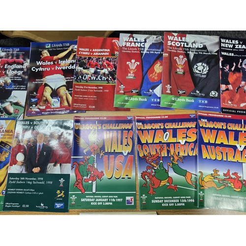 72 - A large collection of Rugby programmes along with a complete The Sun encyclopedia and soccer stamp a... 