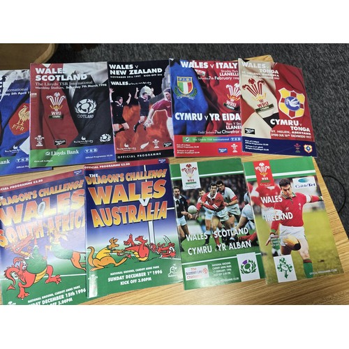 72 - A large collection of Rugby programmes along with a complete The Sun encyclopedia and soccer stamp a... 